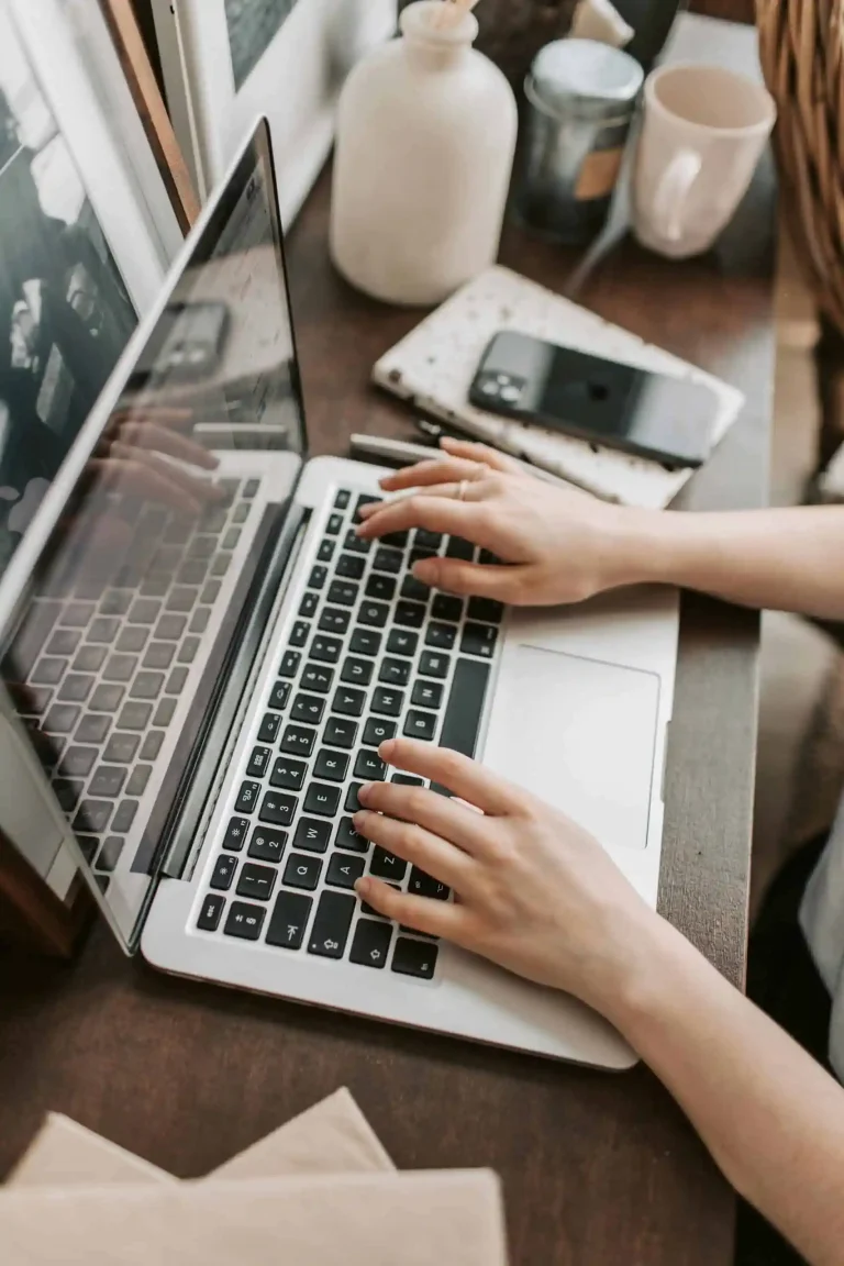 Typing on a laptop